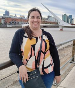 English–Spanish translator standing by a bridge in Buenos Aires, symbolizing communication across languages